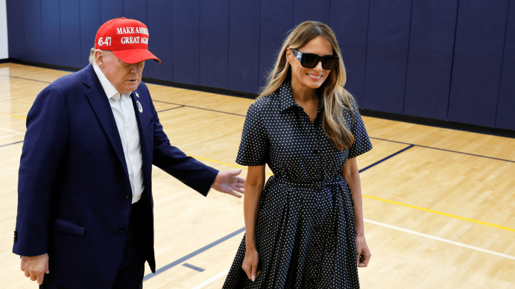 Republican presidential nominee former President Donald Trump escorts his wife Melania Trump at the polling place in the Morton and Barbara Mandel Recreation Center on Election Day, on November 05, 2024 in Palm Beach, Florida.
